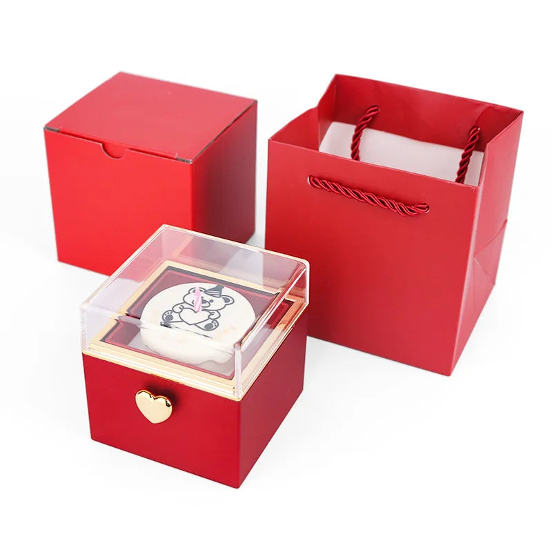 Red gift box with heart charm, clear lid, and matching bag for unique gifts