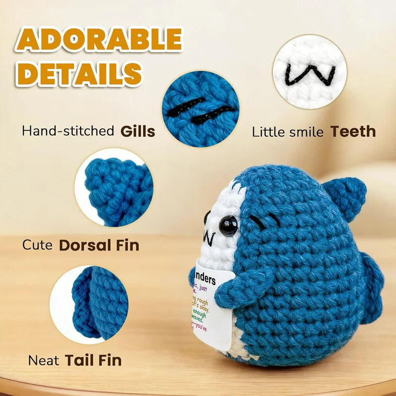 Adorable crocheted blue shark with hand-stitched gills, smile teeth, dorsal fin, and tail fin details