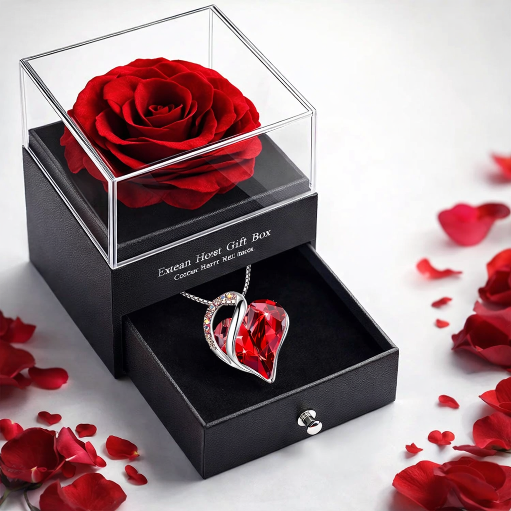 Elegant red rose and heart pendant necklace in luxury gift box with scattered petals