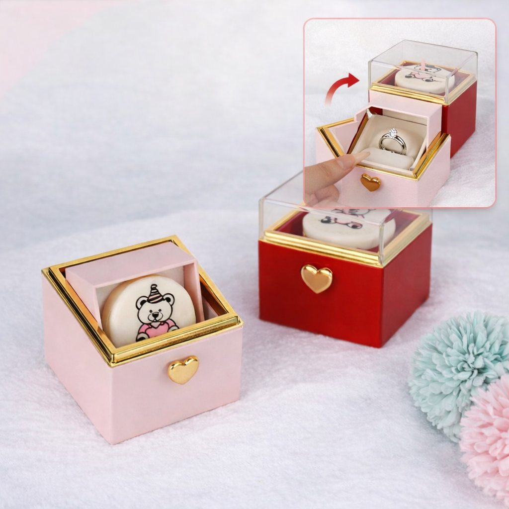 Pink and red heart-accented ring boxes with teddy bear designs, perfect for gifts or jewelry storage