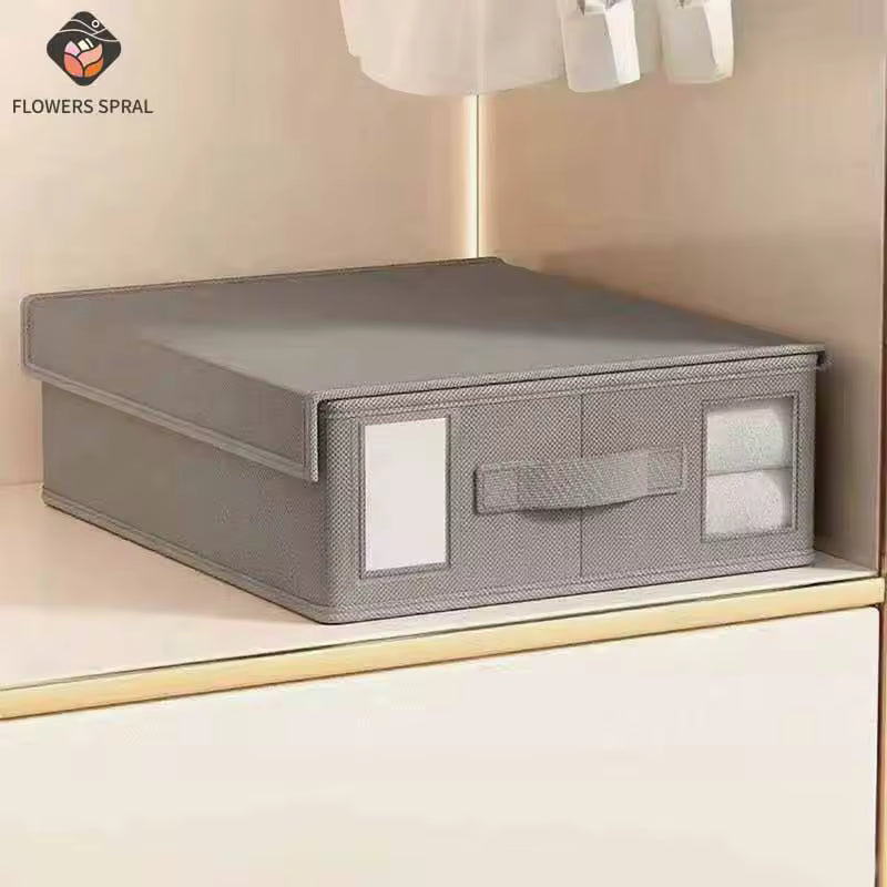 Gray storage box with a handle on a shelf, branded 'Flowers Spral'.