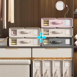 Stack of storage boxes with a focus on the top pink box.
