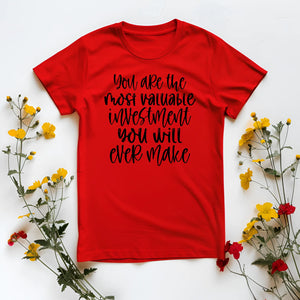 Red t-shirt with motivational quote on a white background with flowers
