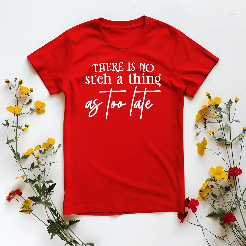 Red t-shirt with motivational quote surrounded by flowers on a white background