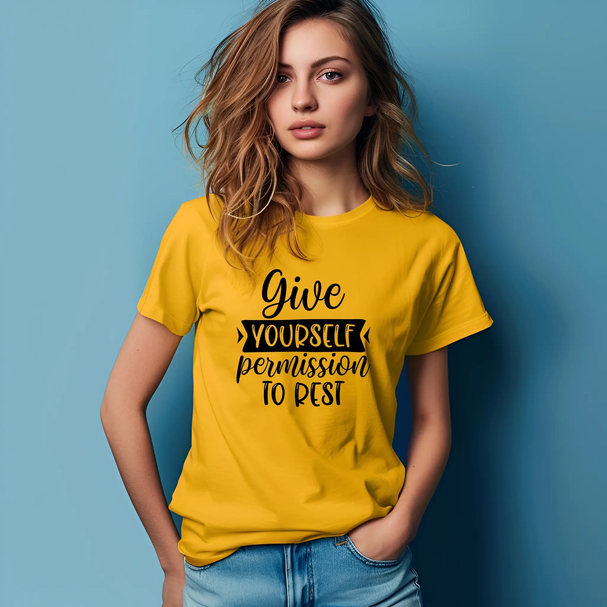 Woman wearing a yellow t-shirt with motivational text against a blue background