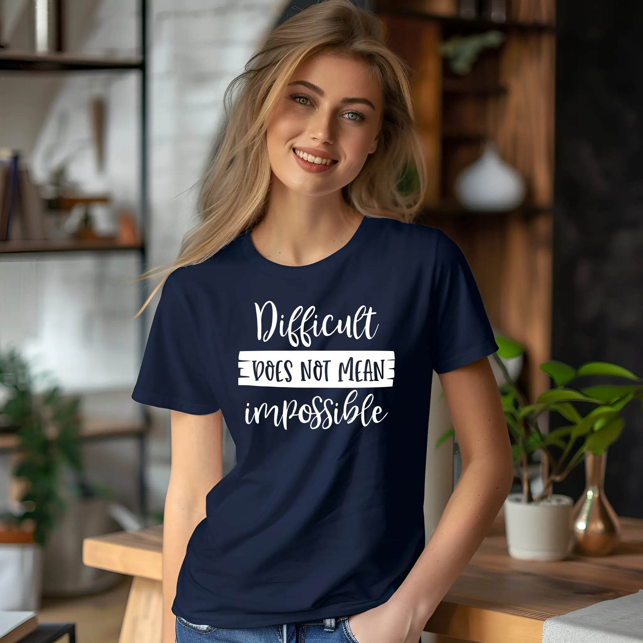 Woman wearing a navy blue t-shirt with motivational quote in a home setting