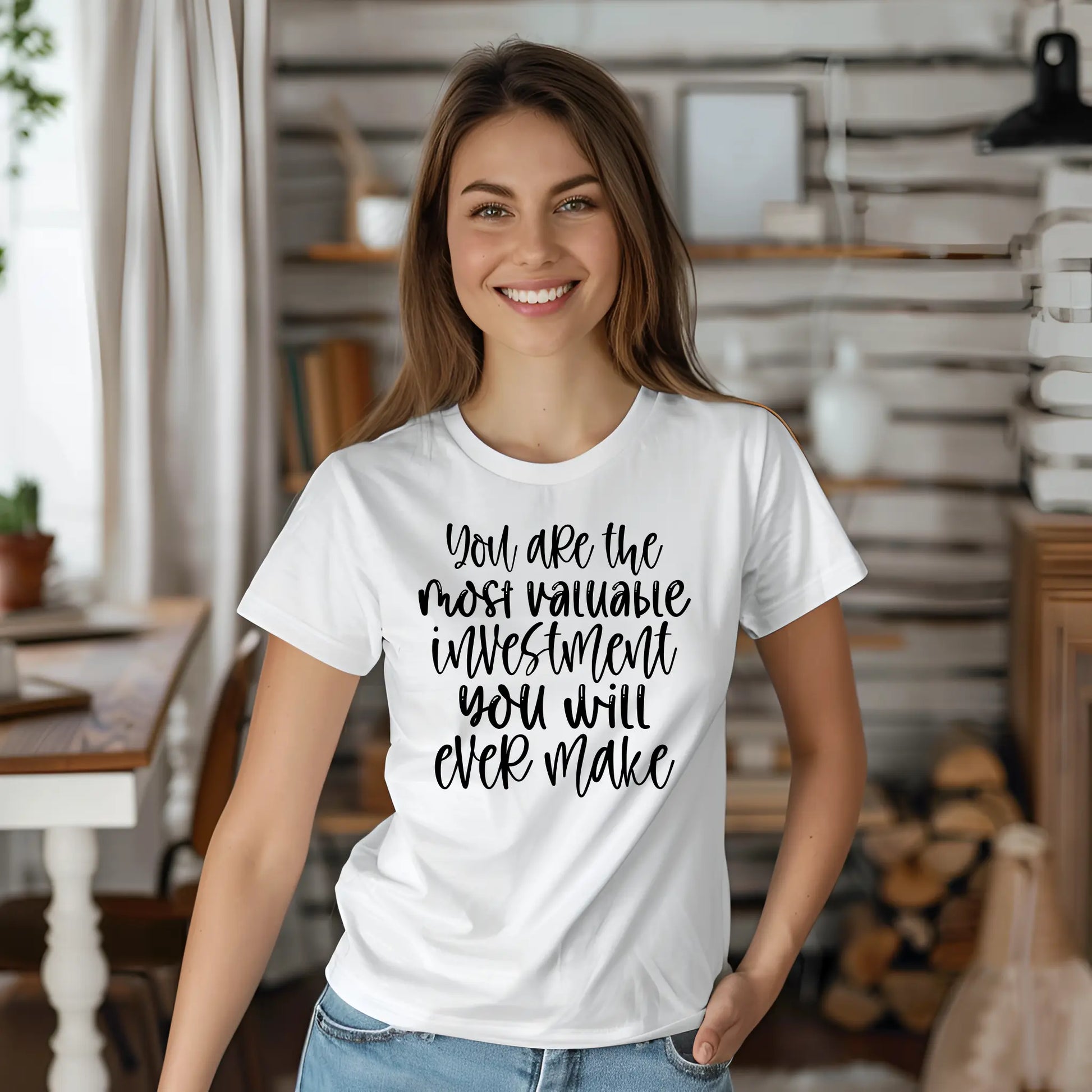 Woman wearing a white t-shirt with motivational quote in a home setting