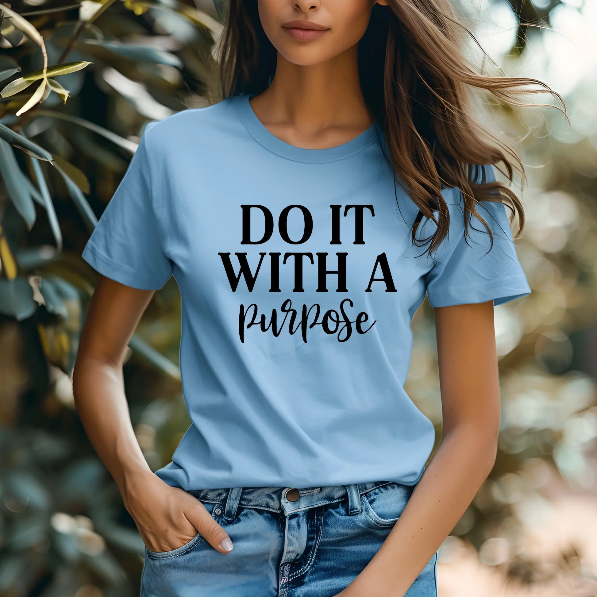 Person wearing a light blue t-shirt with 'Do It With A Purpose' text.