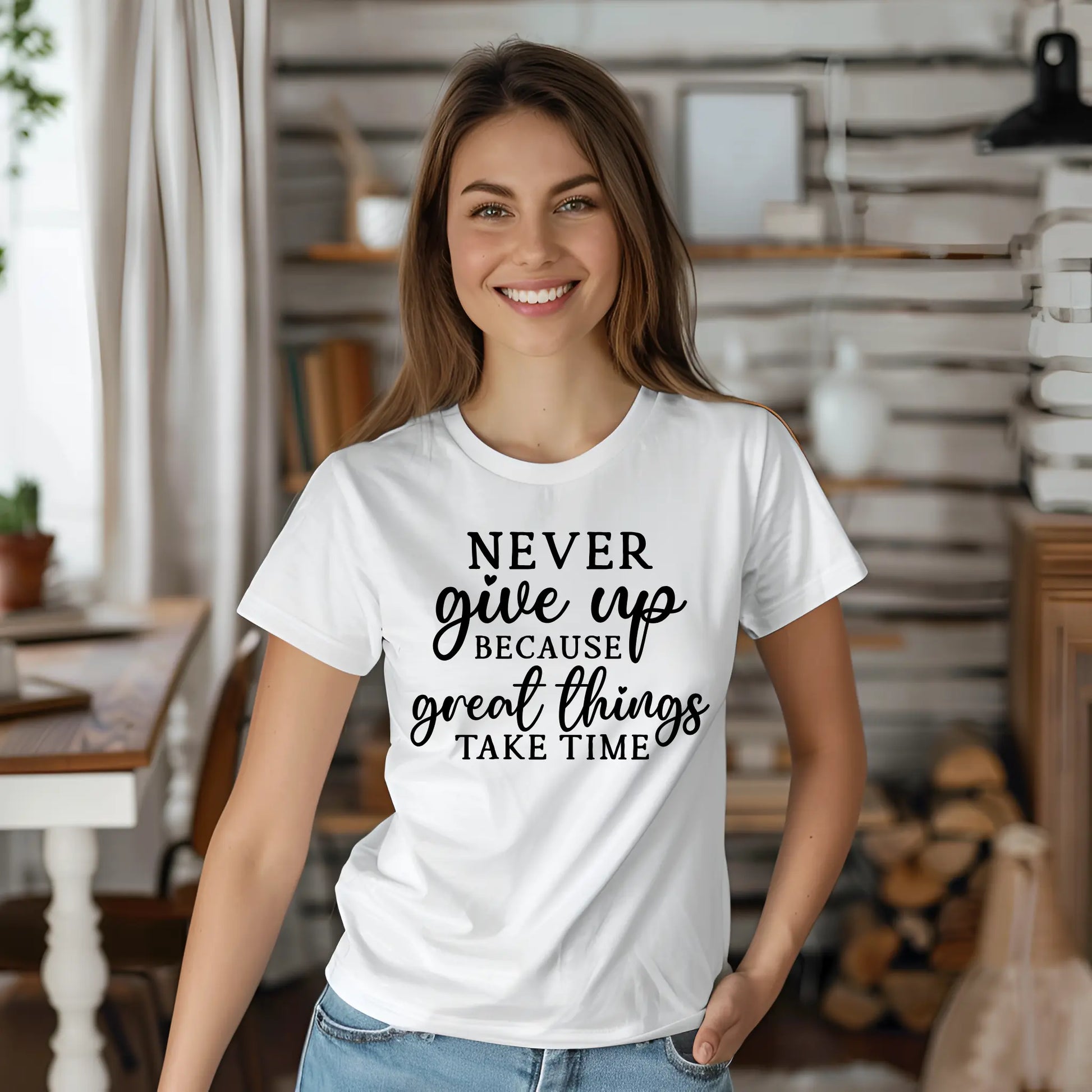 Woman wearing a white t-shirt with a motivational quote in a home setting