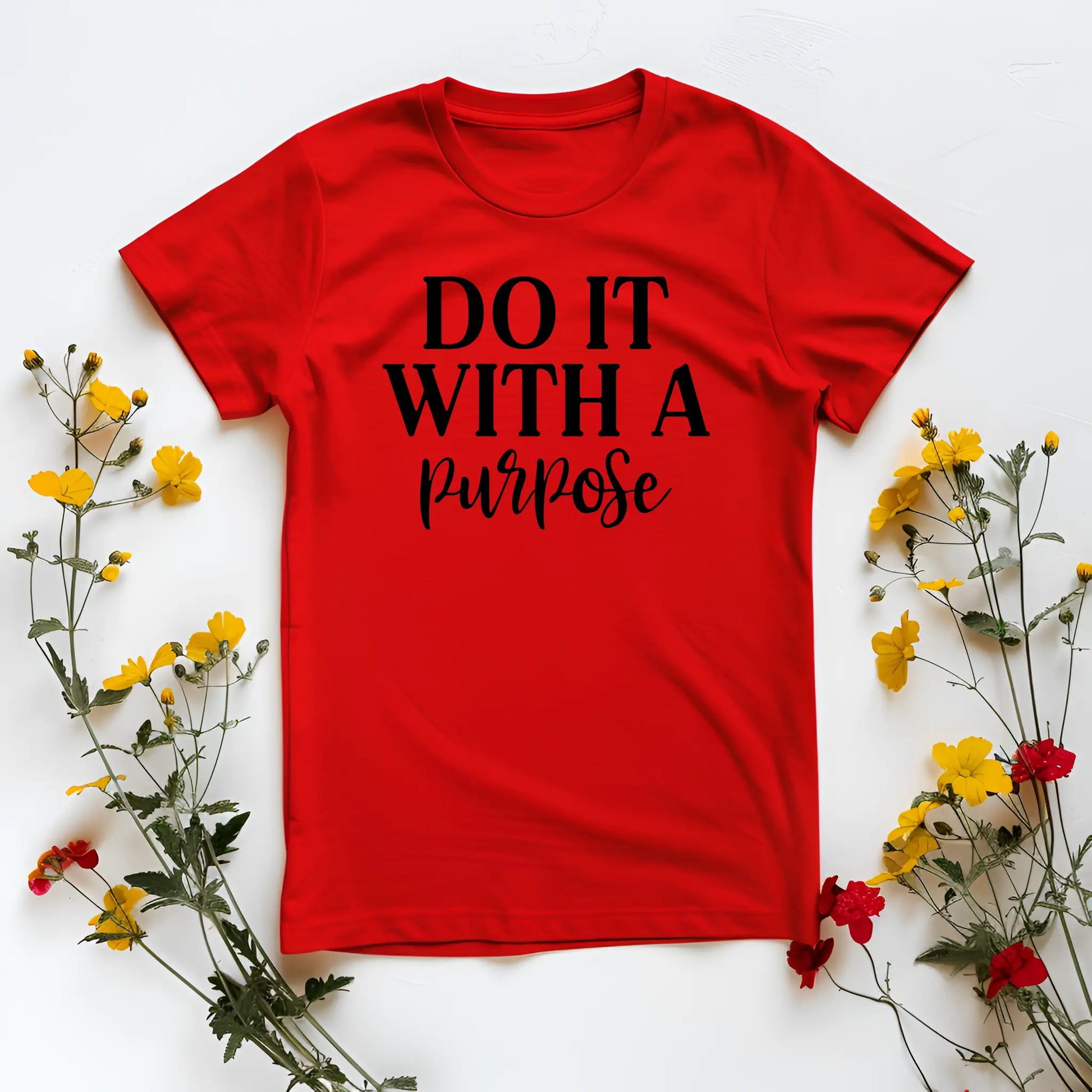 Red t-shirt with 'DO IT WITH A PURPOSE' text on a white background with flowers.