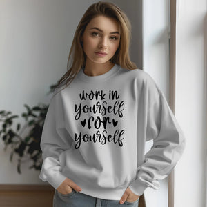 Woman wearing a white sweatshirt with text indoors