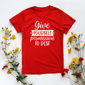 Red t-shirt with motivational quote surrounded by flowers on a white background