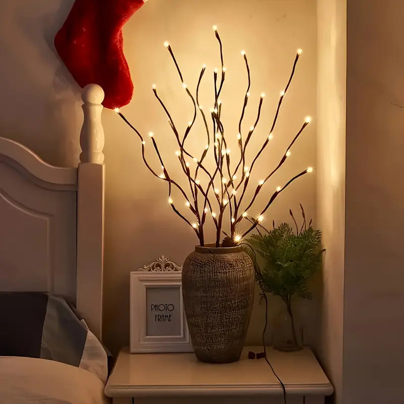Decorative lamp with LED lights on a nightstand next to a bed