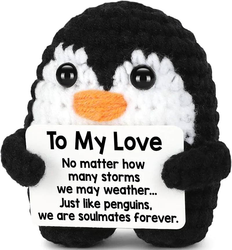 Crocheted penguin holding romantic message card, perfect gift for soulmates and lovers